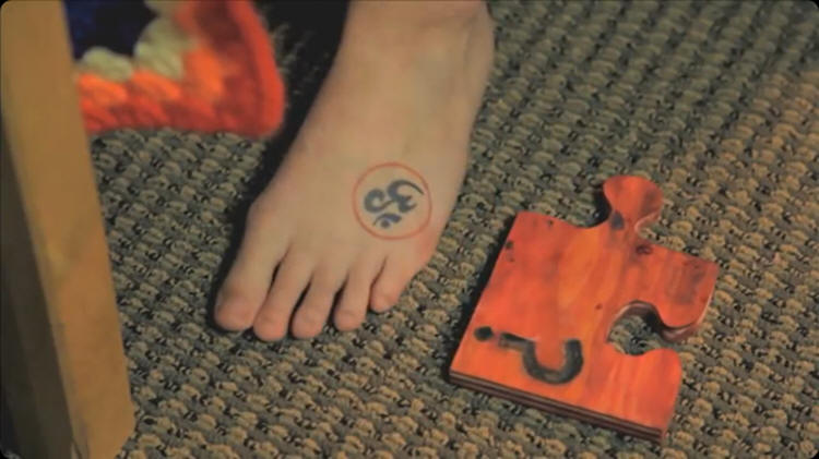 Ken Russell - puzzelface - foot and jigsaw